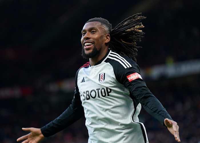 Alex Iwobi pictured celebrating after scoring a late winning goal for Fulham in a 2-1 victory at Manchester United in February 2024